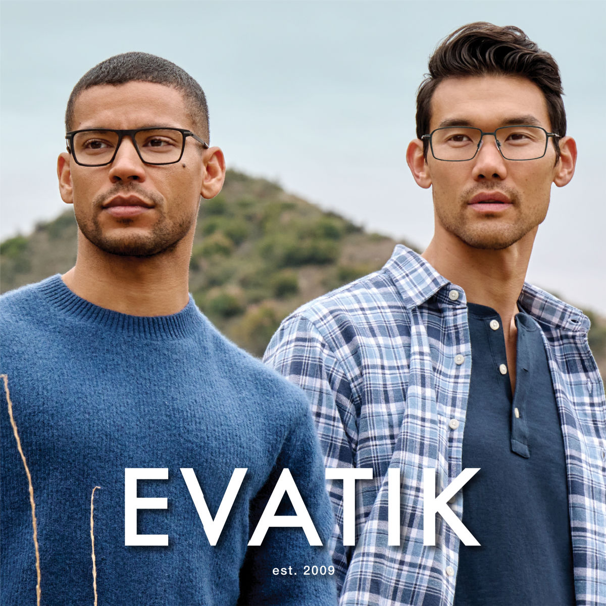 Two male models in stylish blue shirts facing left of the camera modeling two different styles of square frames. EVATIK logo in white along the bottom.