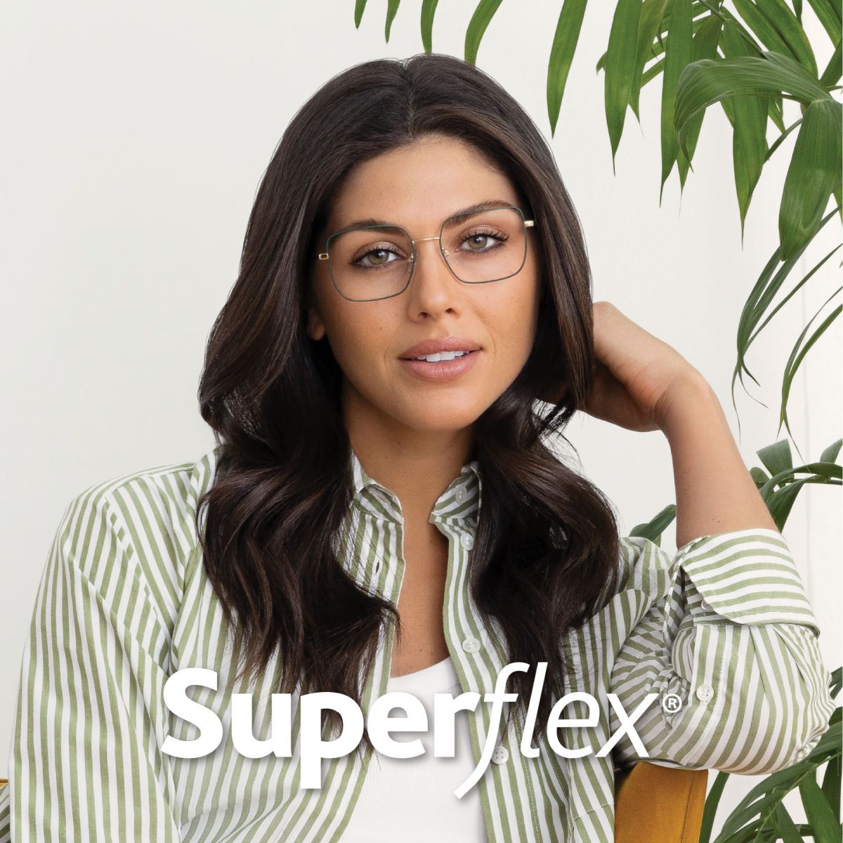 A woman with long dark hair wearing a green and white striped shirt faces the camera modeling delicate green rounded frames. Superflex logo is in white across the bottom of the image.