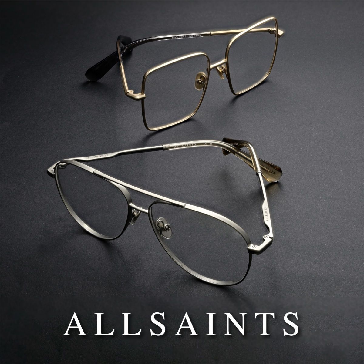 Two pairs of glasses sit on a grey surface. A square gold pair of frames is in the background and a pair of silver double bridge aviators is in the foreground. AllSaints logo in white along the bottom of the image.