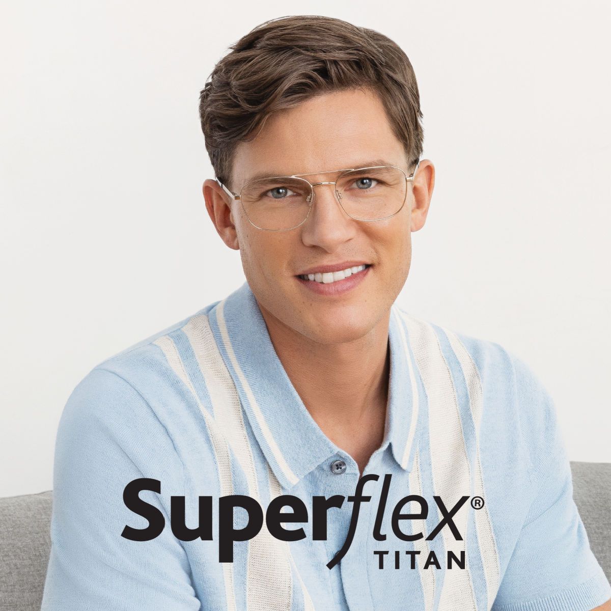 Man looking at camera smiling, wearing classic aviator frames by Superflex Titan