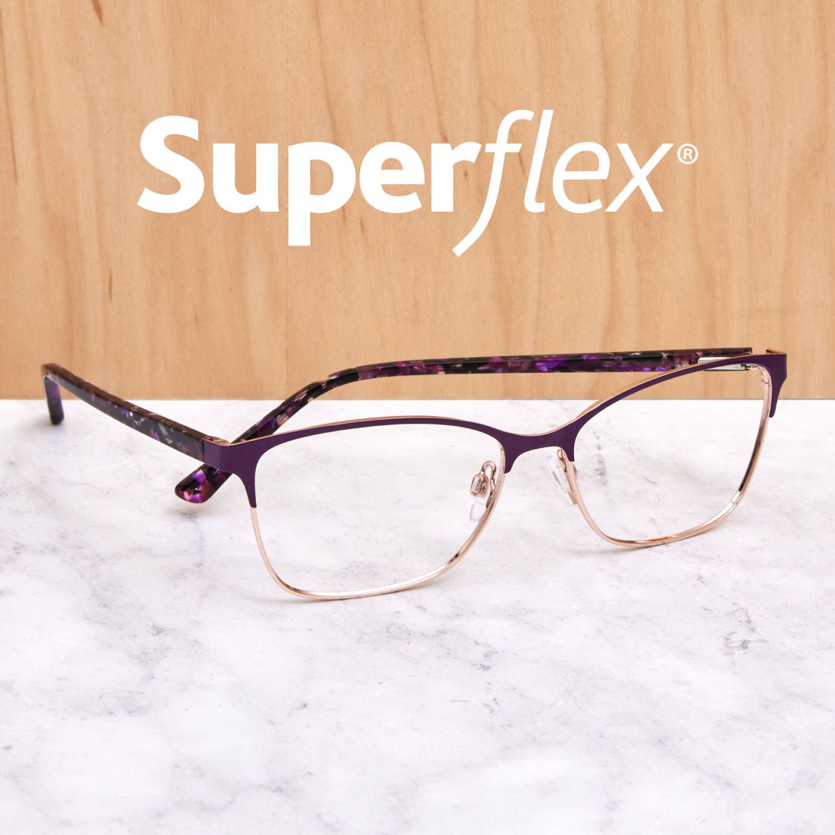 Single pair of purple and gold glasses on a marble counter below Superflex logo